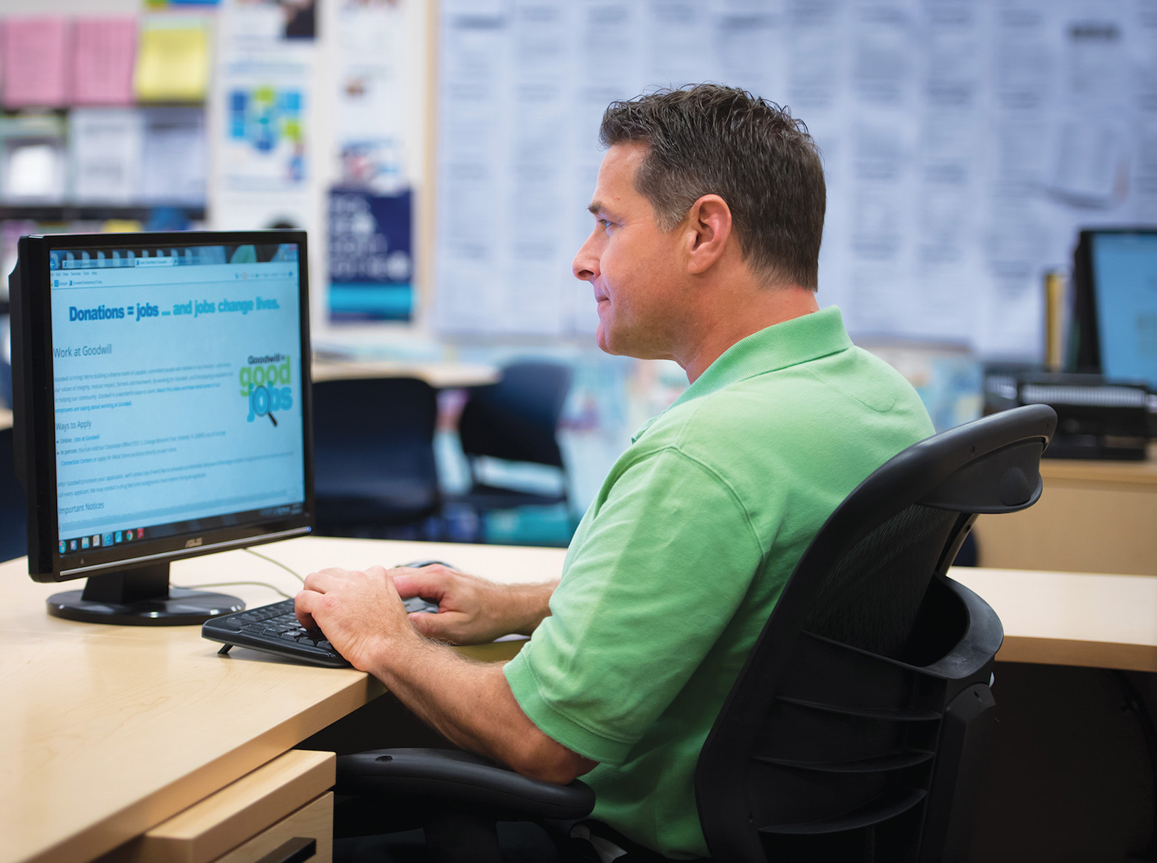 Man on computer looking at donations and jobs page