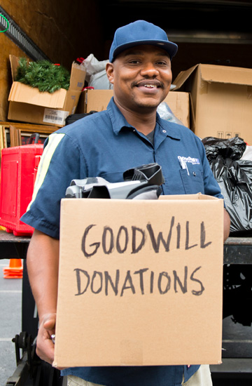 Goodwill volunteer accepting a donation