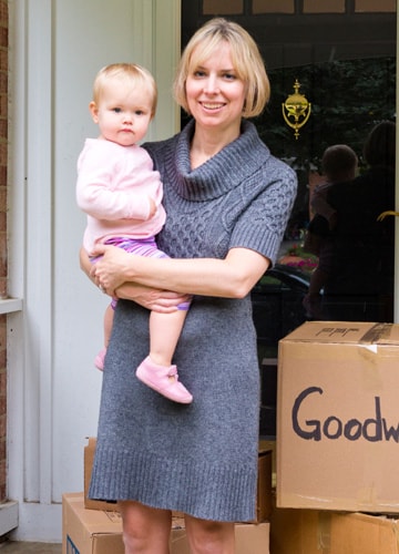 Mother and Child with Goodwill Donation Boxes