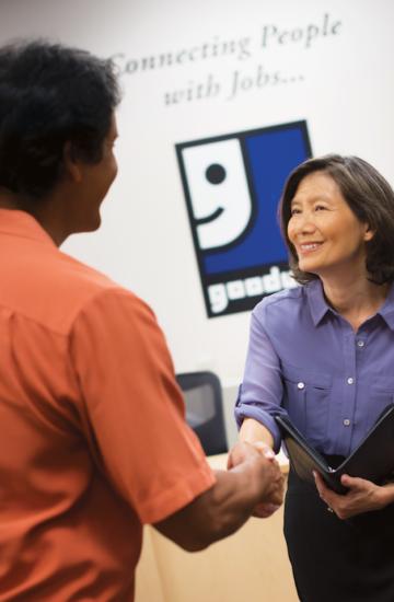 Goodwill teacher and student shaking hands