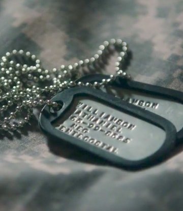 Goodwill helps returning veterans find jobs. (Image of military dog tags laying on camouflage)