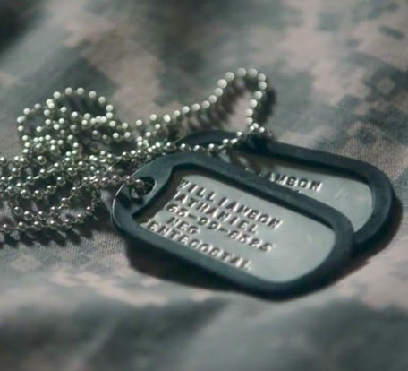 Goodwill helps returning veterans find jobs. (Image of military dog tags laying on camouflage)