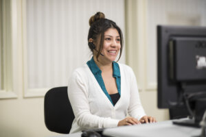 Woman with headset on the computer