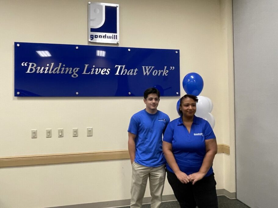 Two employees in front of